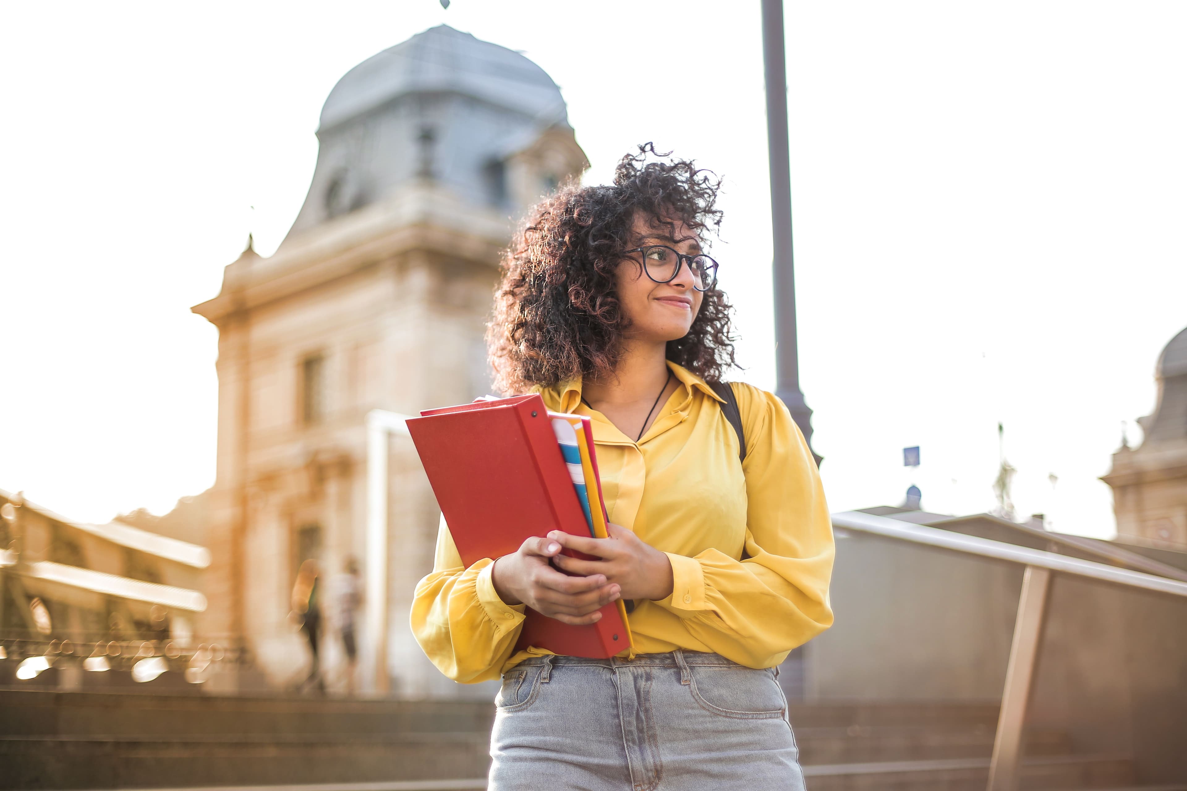 female student holding books