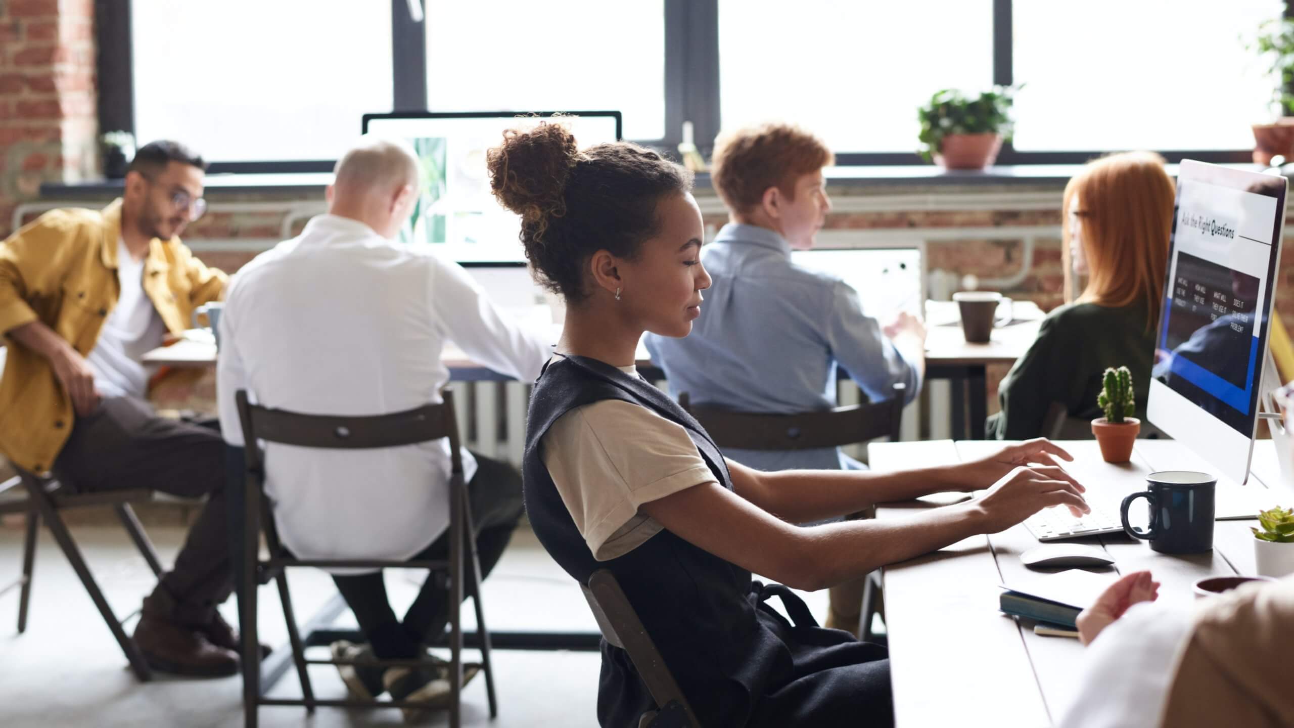 Employees collaborating in an open office