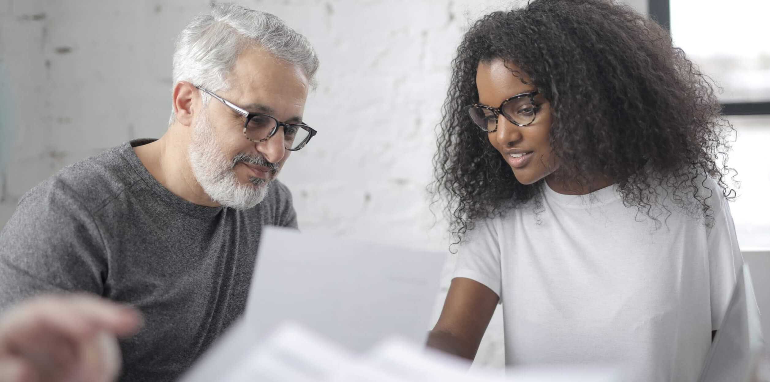 senior man mentors junior employee