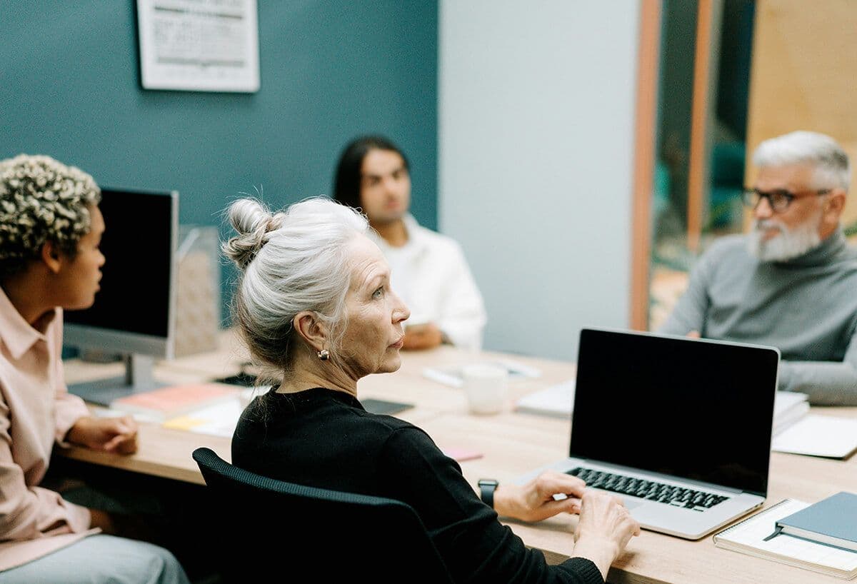 Colleagues meeting around an office table